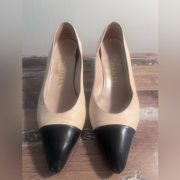 CHANEL Shoes - Chanel Nude and Black Toe Interlocking Logo Leather Pumps Size 8